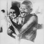 Gandhi hugging a child
