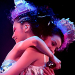 Twin dancers hugging