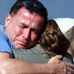 Father hugs deployed daughter goodbye