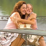 Mom and daughter by lake