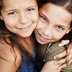 Two girls hugging