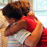 Mom hugs her son