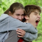 Teens hugging